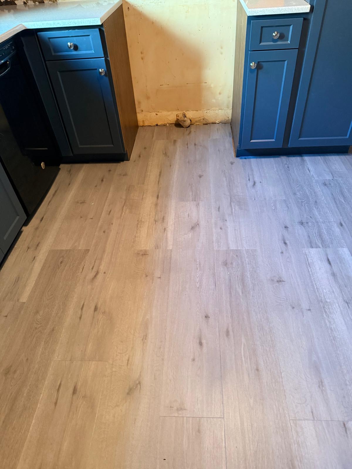 Close view of plank flooring installed in a kitchen