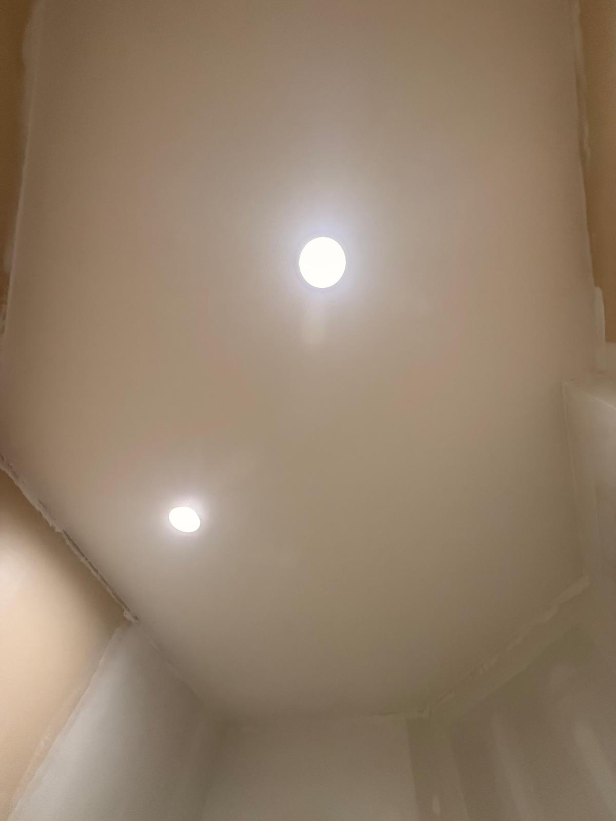 Recessed lights installed in a finished ceiling